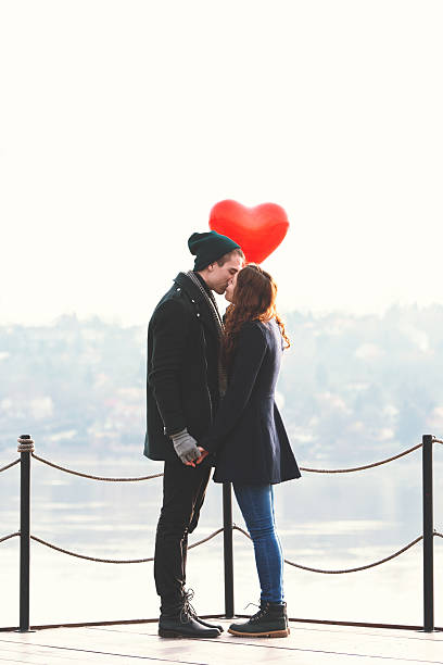Young couple in love at the riverside