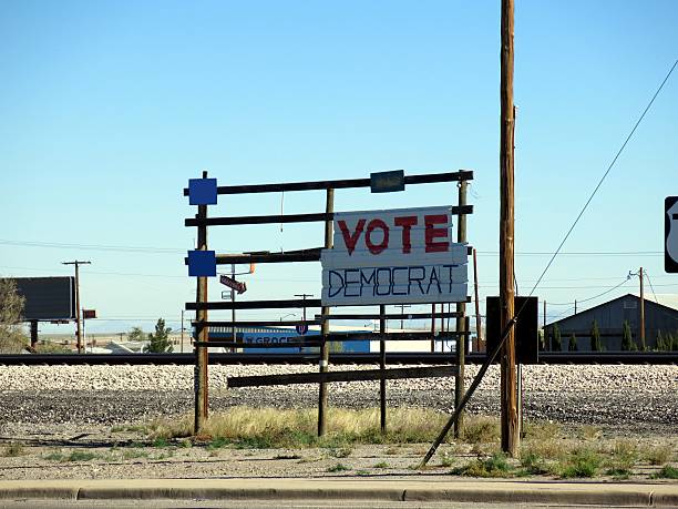 Democrat canvassing in southern USA Lordsburg, USA - December 15, 2015: Canvas of the democratic party on a shabby rack beside the road hillary clinton stock pictures, royalty-free photos & images