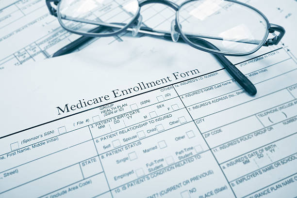 Medicare enrollment form Medicare enrollment form and glasses enrollment stock pictures, royalty-free photos & images