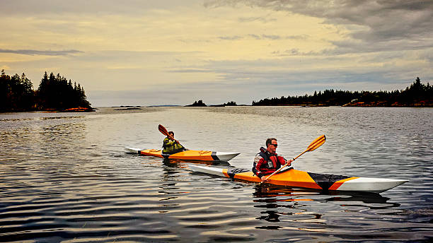 coppia senior kayak - canoeing canoe senior adult couple foto e immagini stock