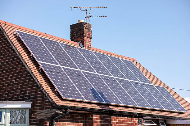 istock Suburban house with solar panels. 518340402