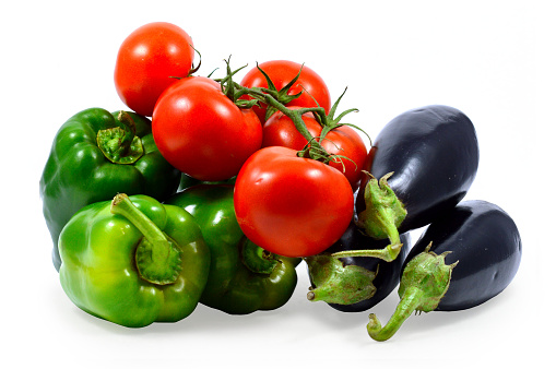 green peppers, eggplant and tomatoes on white background
