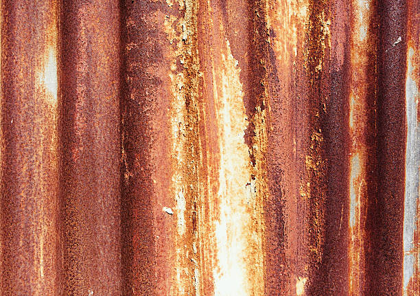 istock Textured grungy industrial background: peeling paint on rusty corrugated iron 518343918