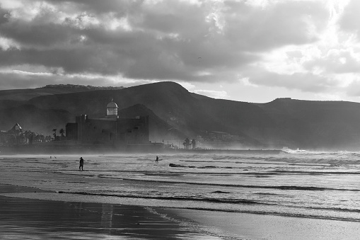 Las Canteras is one of the most famous beaches of Gran Canaria island. It's long and shallow, and has a very noticeable black sand. It is positioned just in front of the capital city of Las Palmas and is a very famous place for surfing.