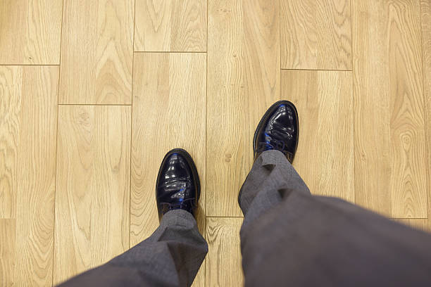 istock Man walking in office on parquet 518344424
