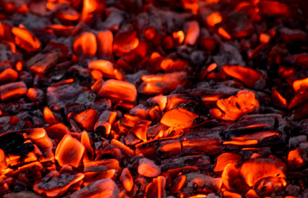 Hot charcoal briquettes background texture