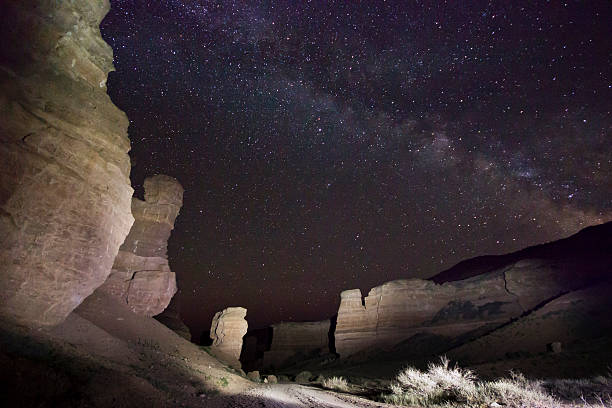 istock night view of desert canyon with big rocks 518346358