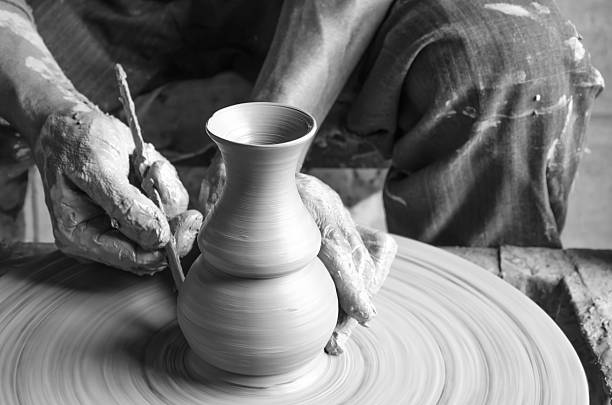 istock Hands of making clay pot ,select focus, close-up. 518348438