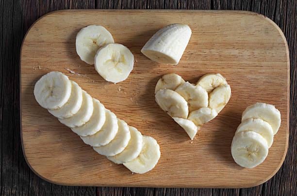 istock Sliced bananas and shape of hearts 518348882