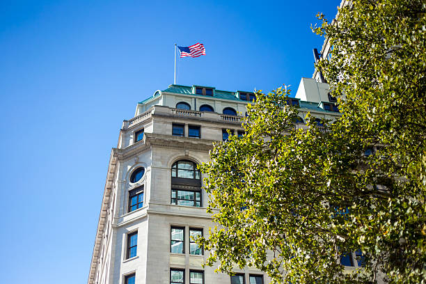 istock America Flag on 1 Broadway Building in Bright Daylight 518351093