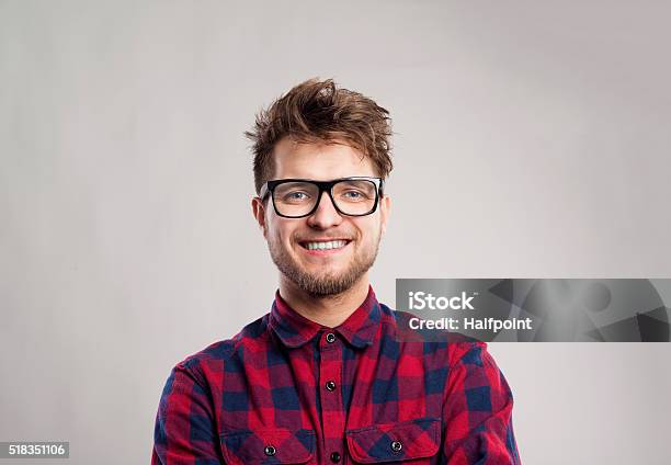 Man In Checked Shirt And Eyeglasses Against Gray Background Stock Photo - Download Image Now