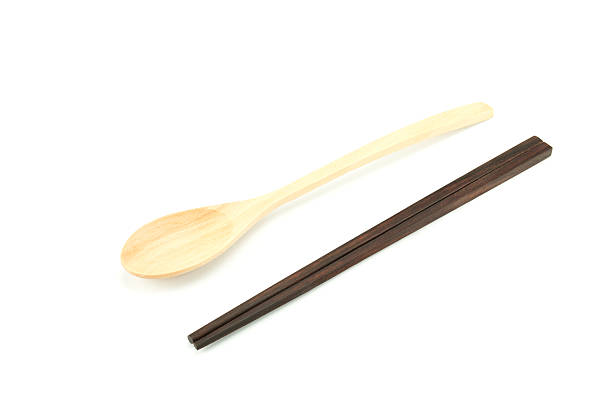 istock Wood chopsticks and spoon on white background 518351673