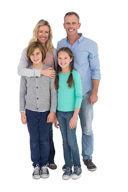 istock Happy family standing and smiling at camera 518353123