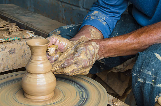 istock Hands of making clay pot ,select focus, close-up. 518354198