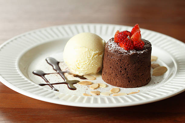istock chocolate lava with vanilla ice cream with strawberry 518354211