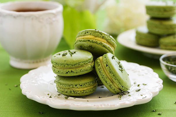 istock French cake with tea makarons match and tarragon. selective focus. 518354338