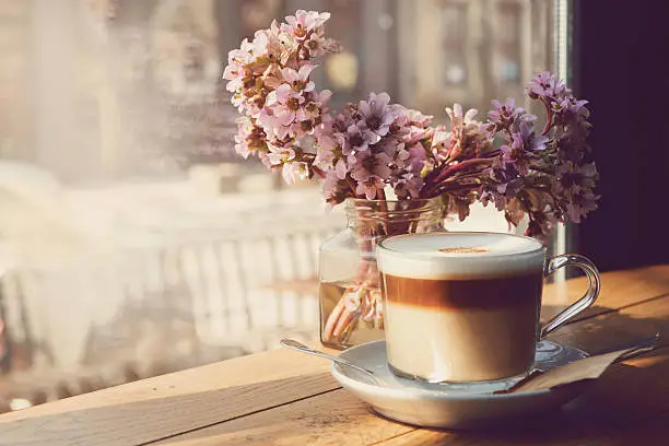 Marocchino coffee in glass, close up.