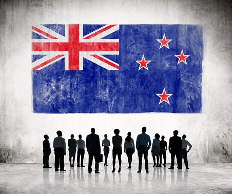 Business People Looking at the Flag of New Zealand