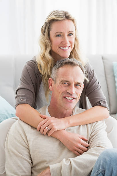 istock Happy casual couple smiling and hugging 518355867
