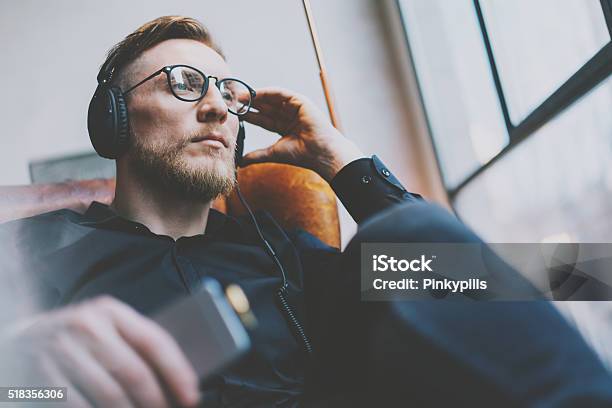Portrait Handsome Bearded Man Glasses Headphones Listening To Music Modern Stock Photo - Download Image Now