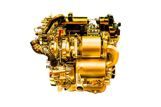 istock modern powerful golden car engine isolated on white background. 518356398