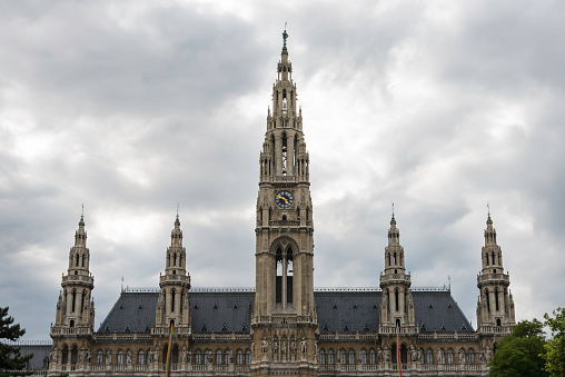 Front view of the towers of Viena's gothic City Hall (Rathaus) on a cloudy Spring day.
