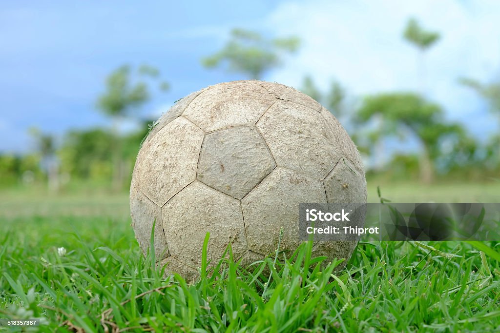Old football on the ground Clothing Stock Photo