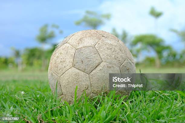 Old Football On The Ground Stock Photo - Download Image Now - Clothing, Grass, Horizontal