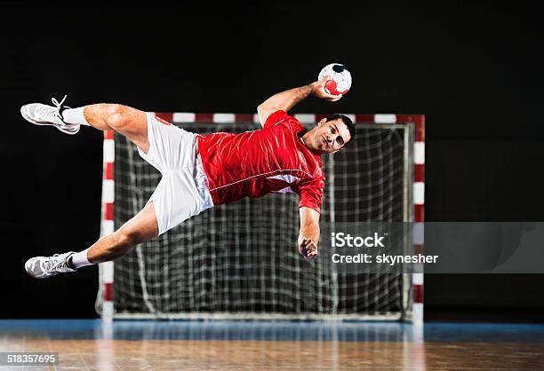 Male Handball Player In Action Stock Photo - Download Image Now - Court Handball, Taking a Shot - Sport, Active Lifestyle