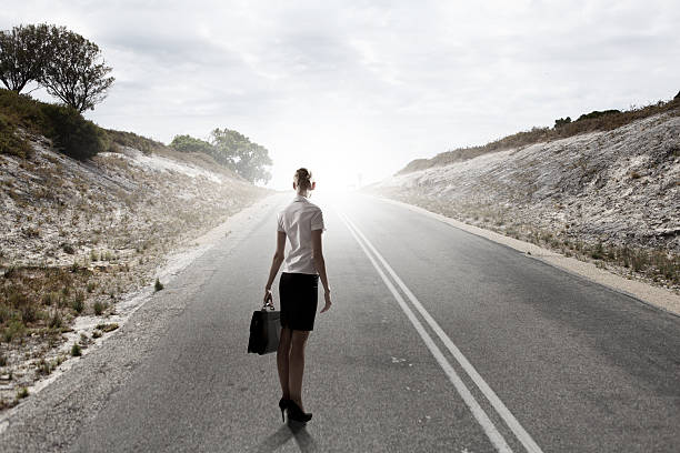 istock Businesswoman on road 518357985