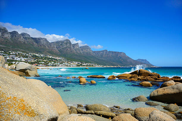 Camps Bay Beach Landscape view of Cape Town Suburb, Camps Bay, on the Atlantic coast with Twelve Apostle mountains in the background cape peninsula photos stock pictures, royalty-free photos & images