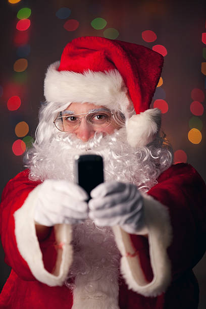 istock Santa Claus Taking A Selfie 518358325
