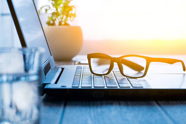 istock Workspace with laptop and glasses. 518358450