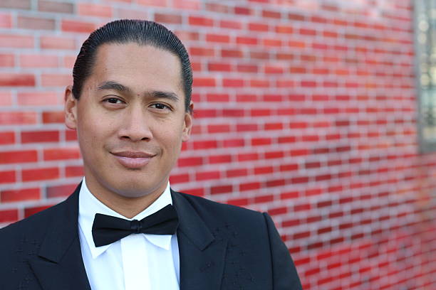 istock Handsome young Asian man in a tuxedo 518358838
