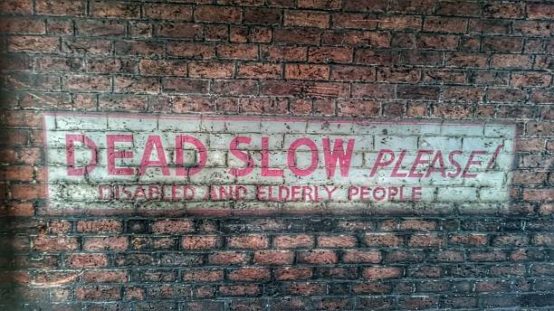 istock Dead Slow Please Vintage Painted Sign 518359968