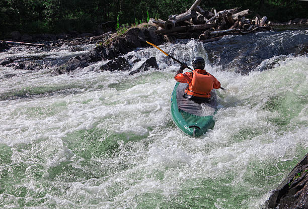 Kayaker in whitewater stock photo