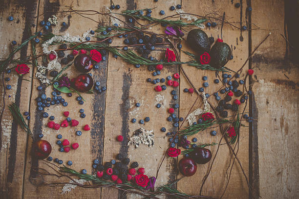istock Berries, plums and avocados on barnwood 518361284