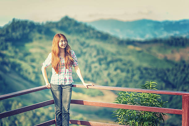 istock Asia beautiful young woman stand on view point 518361452
