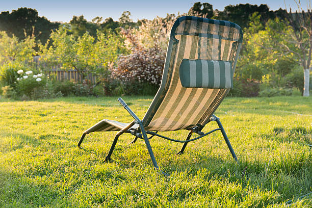istock chaise longue in the garden at sunset background 518365840