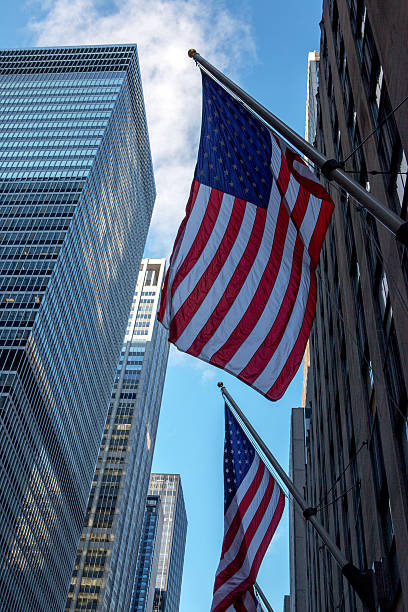 istock USA flag on Manhattan skyscraper 518367816