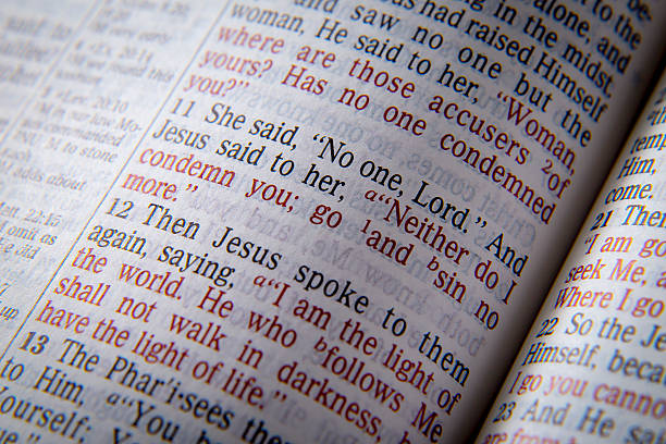 istock Bible text - NEITHER DO I CONDEMN YOU 518368950