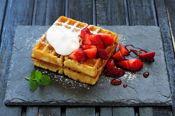 istock Pets (Belgian) waffles with strawberries and whipped cream. 518371524
