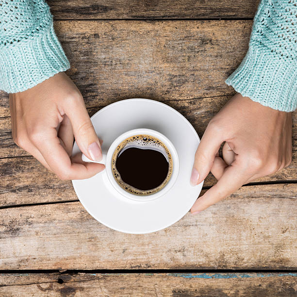 istock Woman's hands holding cup of coffee 518372316