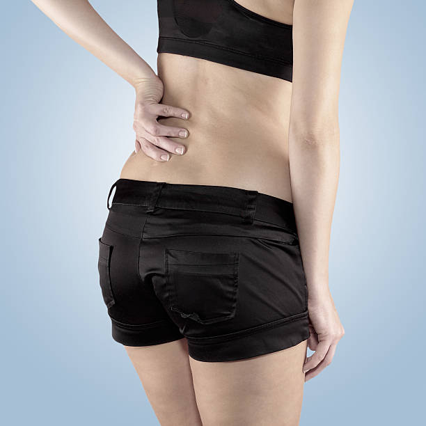 istock Back pain woman. 518376761