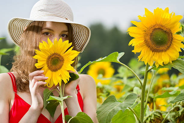 istock Young girl in sunflowers 518377917