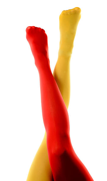 istock female legs with red and yellow tights 518379581