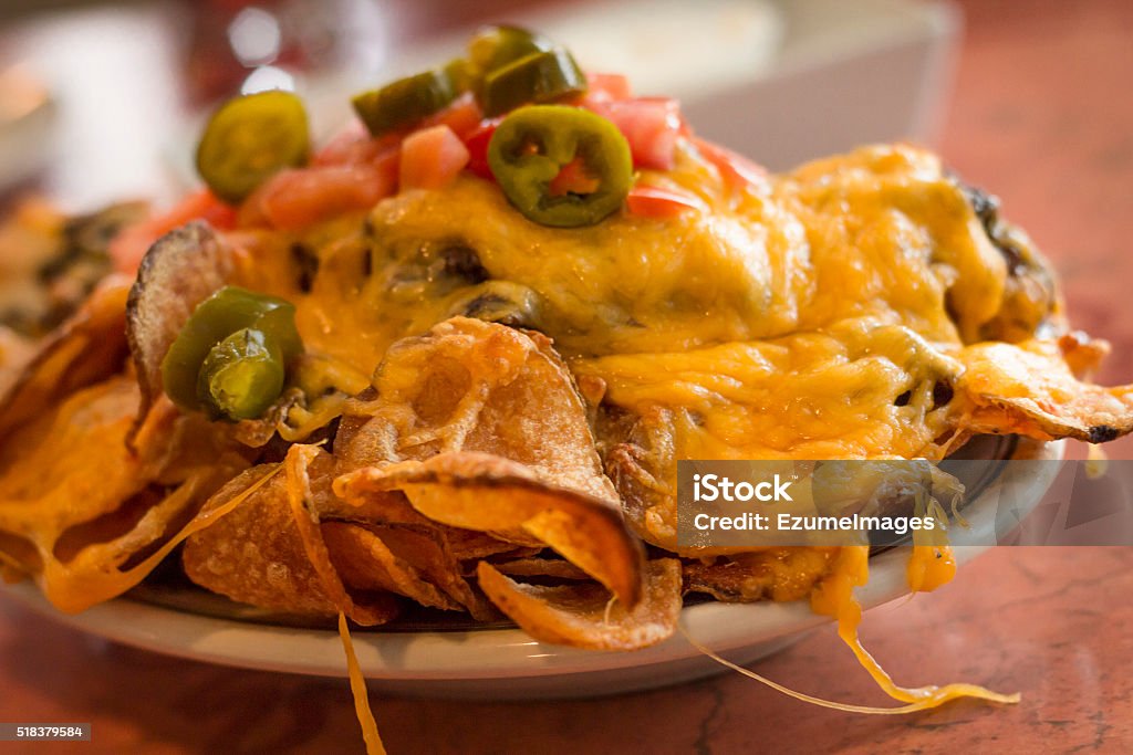 Potato Irish Nachos Loaded potato nachos with melted cheddar cheese Baked Stock Photo