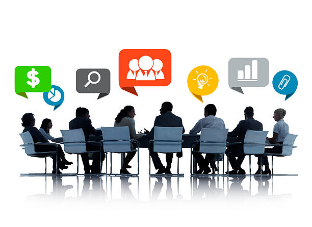 istock Silhouettes of Business People Discussing Teamwork 518380499