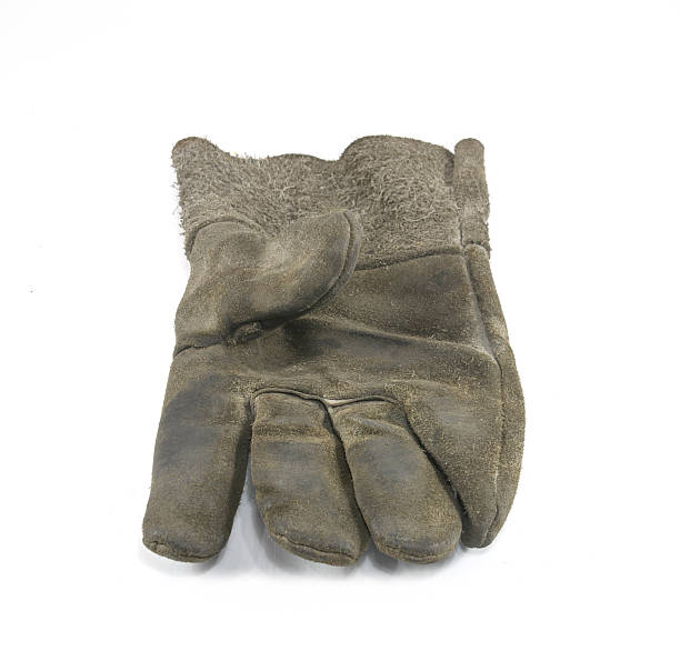 istock Old Dirty Work Gloves Isolated On White 518381275