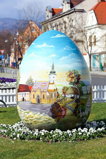 Zagreb, Croatia - March 26, 2016 : Three easter eggs painted with technique naive by hand are placed on the Kaptol square in front of Zagreb Cathedral,Croatia.